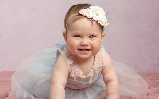 Baby Vera wearing flower headband