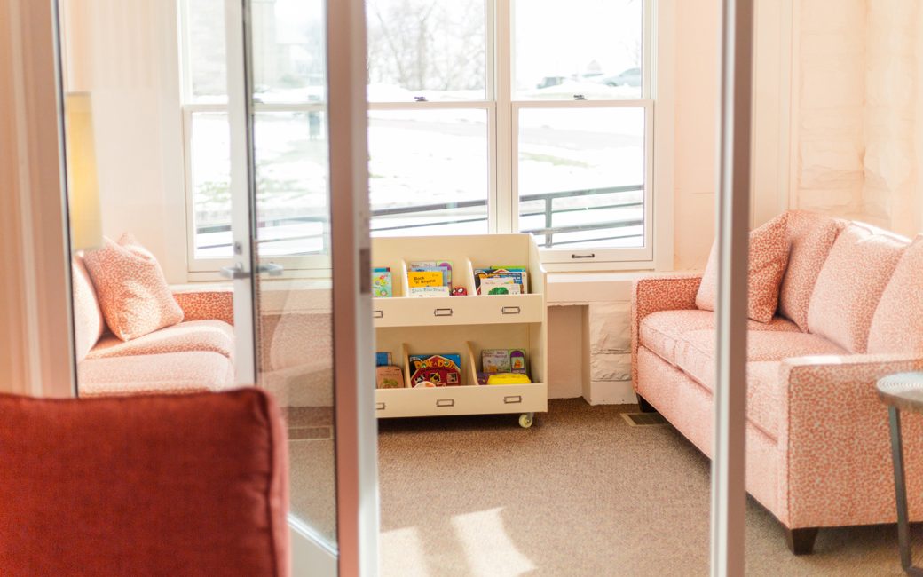 Cincinnati counseling room with large window and pink couches