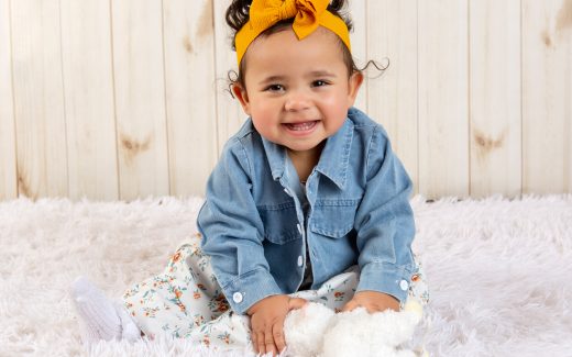 Baby Crystal wearing denim jacket and yellow hair band