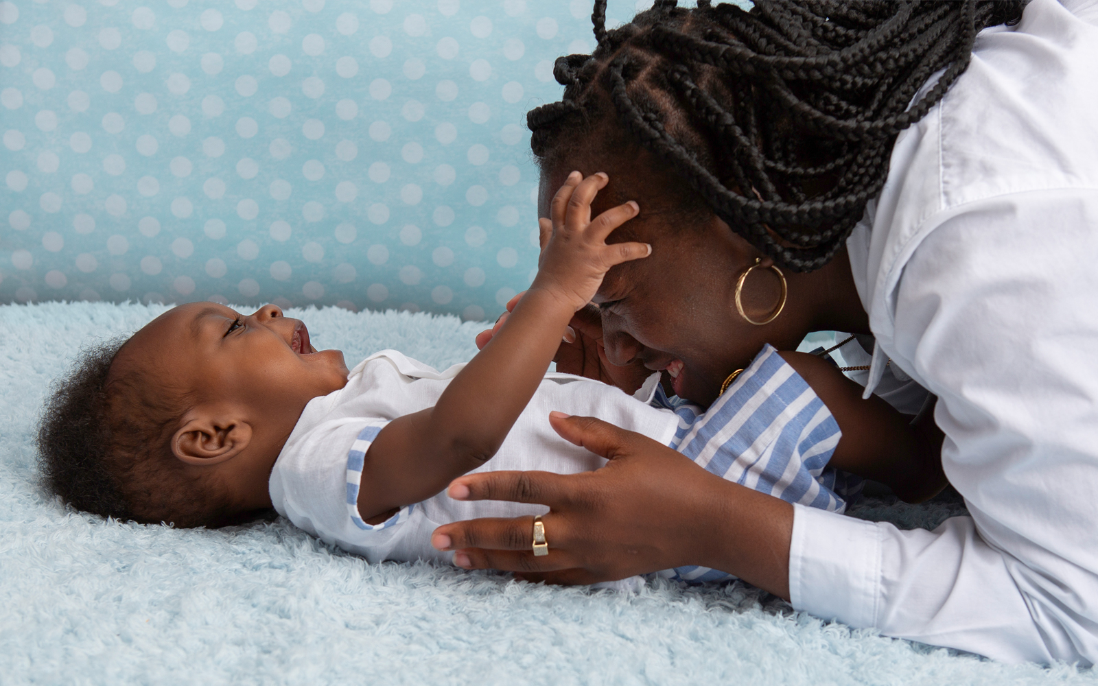 Mom Latheia tickling baby Noah