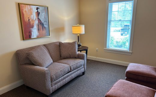 counseling room with couch and lamp