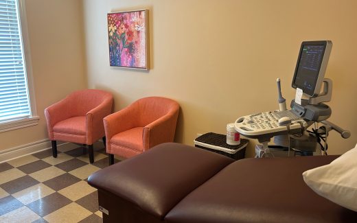 ultrasound room with pink chairs