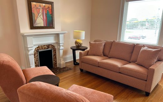 counseling room with couches and fireplace