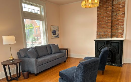 waiting room with large window and fireplace
