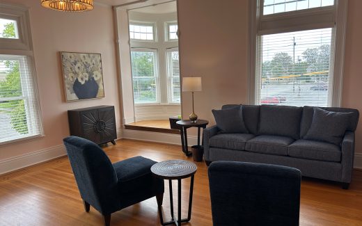waiting room with large windows and navy furniture
