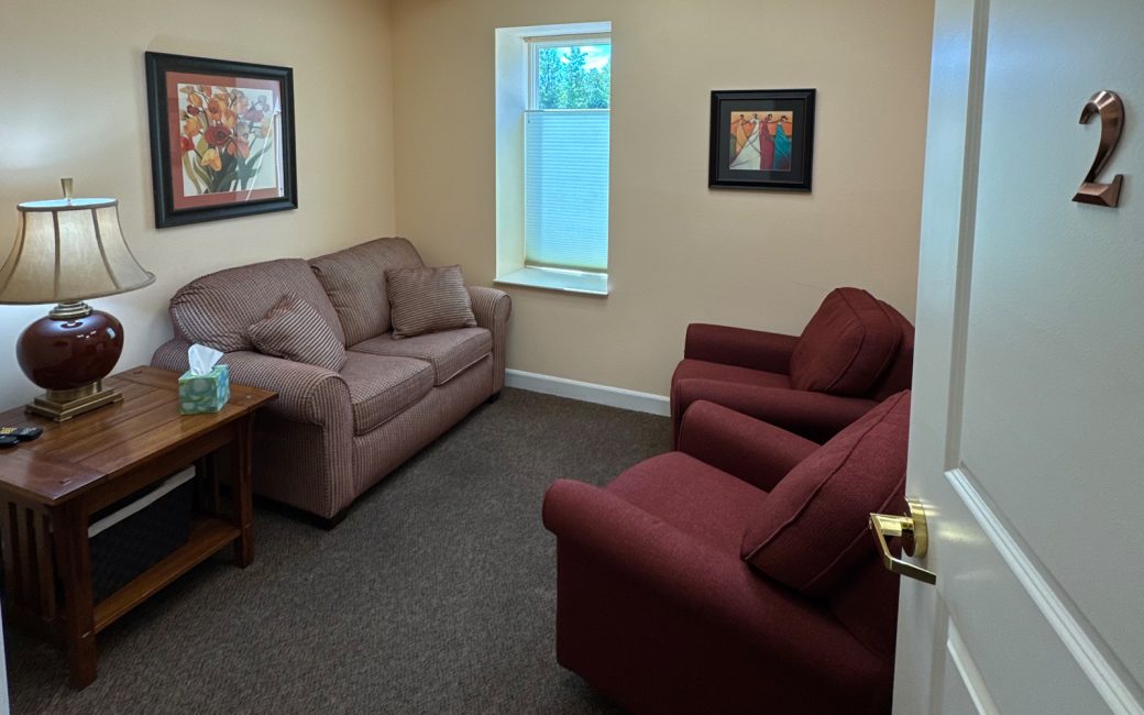 counseling office with burgundy chairs