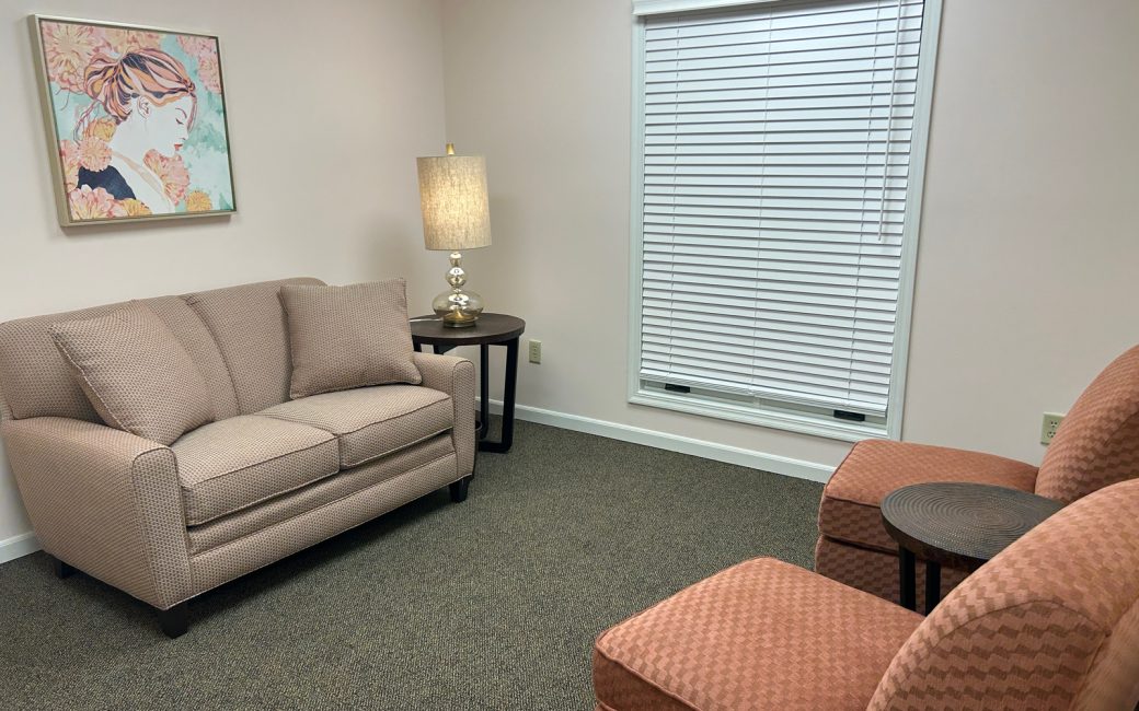 counseling room with cream and orange furniture